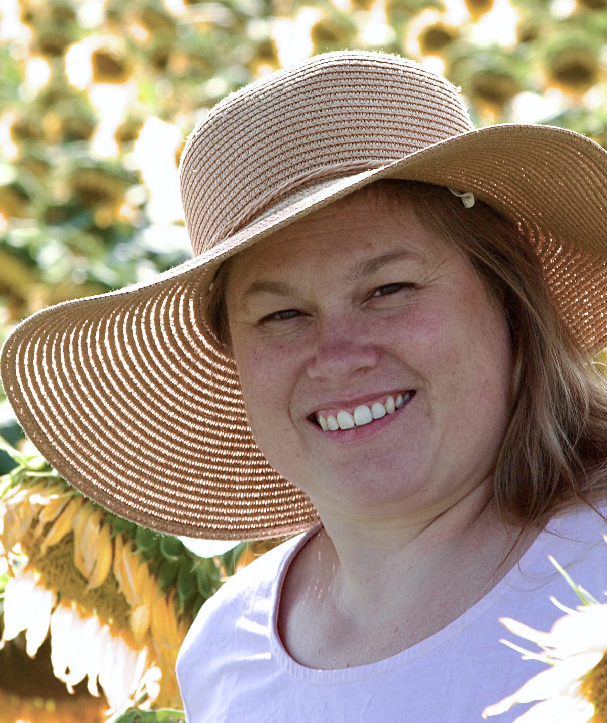 Individual portrait in a sunflower field